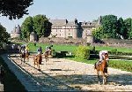 Horse racing by a castle